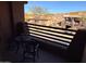 Relaxing balcony with outdoor seating and views of neighboring homes and desert landscape at 10222 E Southwind Ln # 1054, Scottsdale, AZ 85262