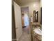 Bathroom with granite countertops, a sink, a toilet, a towel rack, and a walk-in shower at 10222 E Southwind Ln # 1054, Scottsdale, AZ 85262