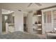 Bright bedroom with an ensuite bathroom boasts a sitting area and ample storage space at 10222 E Southwind Ln # 1054, Scottsdale, AZ 85262