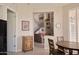 Open-concept living area featuring hardwood floors, staircase, and access to the kitchen and sitting area at 10222 E Southwind Ln # 1054, Scottsdale, AZ 85262