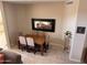 Cozy dining room with seating for six, complemented by neutral walls and tile flooring at 10222 E Southwind Ln # 1054, Scottsdale, AZ 85262