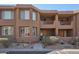 Stylish two-story townhome with a well-maintained front yard, desert landscaping, and inviting entryways at 10222 E Southwind Ln # 1054, Scottsdale, AZ 85262