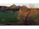 Scenic golf course view featuring lush green fairway and mountain views at sunrise at 10222 E Southwind Ln # 1054, Scottsdale, AZ 85262