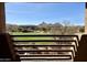 Balcony view of a lush green golf course with mountains in the distance at 10222 E Southwind Ln # 1054, Scottsdale, AZ 85262