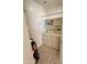 Well organized Laundry room with Washer, Dryer, and storage shelving at 10222 E Southwind Ln # 1054, Scottsdale, AZ 85262