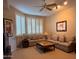 Inviting living room with plush sofas, a ceiling fan, and lots of natural light at 10222 E Southwind Ln # 1054, Scottsdale, AZ 85262