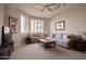 Inviting living room featuring neutral tones, comfortable seating, and large windows with plantation shutters at 10222 E Southwind Ln # 1054, Scottsdale, AZ 85262