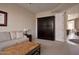 Cozy living room with a murphy bed, plush sofa, and neutral decor provides a flexible space at 10222 E Southwind Ln # 1054, Scottsdale, AZ 85262