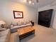 Comfortable living room features a sofa, decorative coffee table, and a stylish dark wood murphy bed at 10222 E Southwind Ln # 1054, Scottsdale, AZ 85262