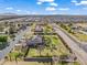 A large house set on a verdant lawn with desert landscaping, mature trees, and circular drive at 1096 W Via De Palmas --, San Tan Valley, AZ 85140