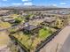 Wide aerial view of a single Gathering home featuring an expansive lawn and desert landscaping at 1096 W Via De Palmas --, San Tan Valley, AZ 85140