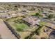 Expansive aerial view of a single Gathering home on a manicured lawn with desert landscape at 1096 W Via De Palmas --, San Tan Valley, AZ 85140