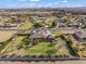 Wide angle aerial view of a single Gathering home set on a lush lawn in a desert community at 1096 W Via De Palmas --, San Tan Valley, AZ 85140