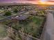 Aerial view showcasing a well-maintained property with lush lawns, mature trees, and lovely landscaping at 1096 W Via De Palmas --, San Tan Valley, AZ 85140