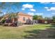 Spacious backyard featuring a lawnmower, trailer, and green lawn at 1096 W Via De Palmas --, San Tan Valley, AZ 85140