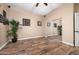 Comfortable bedroom with wood floors, ceiling fan and a large mirrored closet at 1096 W Via De Palmas --, San Tan Valley, AZ 85140