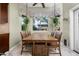 Dining area with a large wooden table, seating for six, and bright natural light at 1096 W Via De Palmas --, San Tan Valley, AZ 85140