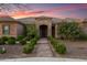 Charming home with stone accents, desert landscaping, and a welcoming walkway at 1096 W Via De Palmas --, San Tan Valley, AZ 85140