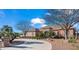 Beautiful single-story home with a private driveway, mature trees, and well-maintained landscaping under a bright blue sky at 1096 W Via De Palmas --, San Tan Valley, AZ 85140