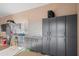 Organized garage with ample storage cabinets and a workstation at 1096 W Via De Palmas --, San Tan Valley, AZ 85140