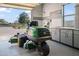 Clean and well-maintained garage with a lawnmower and ample natural light at 1096 W Via De Palmas --, San Tan Valley, AZ 85140