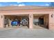 Three car garage showcasing vehicles and storage at 1096 W Via De Palmas --, San Tan Valley, AZ 85140