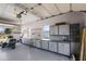 Brightly lit garage with ample workbench, sink, and cabinet storage at 1096 W Via De Palmas --, San Tan Valley, AZ 85140