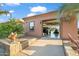 Garage featuring a window and containing vehicles, plus landscaping including desert plants at 1096 W Via De Palmas --, San Tan Valley, AZ 85140
