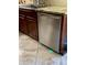 Close-up of stainless steel dishwasher beside sink with tan tile flooring at 1096 W Via De Palmas --, San Tan Valley, AZ 85140