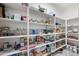 Walk-in pantry with lots of shelving and ample storage space for food and supplies at 1096 W Via De Palmas --, San Tan Valley, AZ 85140