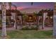 Beautiful backyard pergola with draped curtains and lush greenery at 1096 W Via De Palmas --, San Tan Valley, AZ 85140