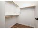 Empty walk-in closet featuring wood floors and ample shelving space for organization at 1096 W Via De Palmas --, San Tan Valley, AZ 85140