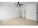 Expansive bedroom featuring neutral tile flooring and an open doorway at 1120 W Barrow Dr, Chandler, AZ 85224