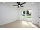 Bright bedroom with a ceiling fan and a window view of the neighborhood at 1120 W Barrow Dr, Chandler, AZ 85224