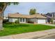 Single Gathering home with an attached garage, manicured lawn, and desert landscaping in front at 1120 W Barrow Dr, Chandler, AZ 85224
