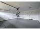 Clean, spacious garage with epoxy flooring, a new water heater, and ample room for storage at 1120 W Barrow Dr, Chandler, AZ 85224