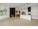Spacious kitchen with a large island, stainless steel appliances, and modern pendant lighting at 1120 W Barrow Dr, Chandler, AZ 85224