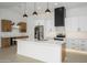 Kitchen boasts a central island, sleek countertops, and stainless steel appliances at 1120 W Barrow Dr, Chandler, AZ 85224