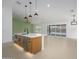 Spacious open kitchen with a large island, modern appliances, and views into the bright living area at 1120 W Barrow Dr, Chandler, AZ 85224