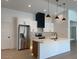 Modern kitchen with stainless steel appliances, white cabinets, and an island at 1120 W Barrow Dr, Chandler, AZ 85224
