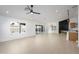Bright, open living room with recessed lighting, large windows, and sliding glass doors at 1120 W Barrow Dr, Chandler, AZ 85224