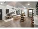 Bright and spacious coffee shop area with modern decor, ample seating, and a well-equipped counter at 11300 N Casa Dega Dr # 1006, Surprise, AZ 85388