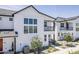 Charming two-story home with a balcony, complemented by desert landscaping and modern design at 11300 N Casa Dega Dr # 1006, Surprise, AZ 85388