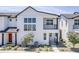 Stylish two-story home featuring a balcony, large windows, and modern architectural details at 11300 N Casa Dega Dr # 1006, Surprise, AZ 85388