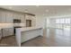 Open-concept kitchen with stainless steel appliances and a central island at 11300 N Casa Dega Dr # 1006, Surprise, AZ 85388