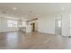 Open-concept living space featuring hardwood floors, a modern kitchen, and ample natural light at 11300 N Casa Dega Dr # 1006, Surprise, AZ 85388