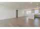 Spacious living area with hardwood floors, recessed lighting, and access to a modern kitchen at 11300 N Casa Dega Dr # 1006, Surprise, AZ 85388