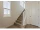 Bright staircase features wood treads, white risers and natural light at 11300 N Casa Dega Dr # 1006, Surprise, AZ 85388