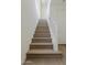 Bright staircase features wood treads, white risers and natural light at 11300 N Casa Dega Dr # 1006, Surprise, AZ 85388
