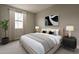 Cozy bedroom featuring a bed with stylish pillows and a window with natural light at 11300 N Casa Dega Dr # 1020, Surprise, AZ 85388